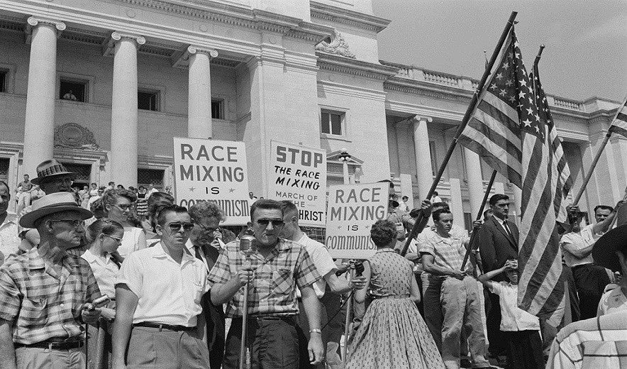 Not just for yourself.  At Little Rock, Arkansas, Central High School, in August 1959.  Anti integration protesters show their ignorance.